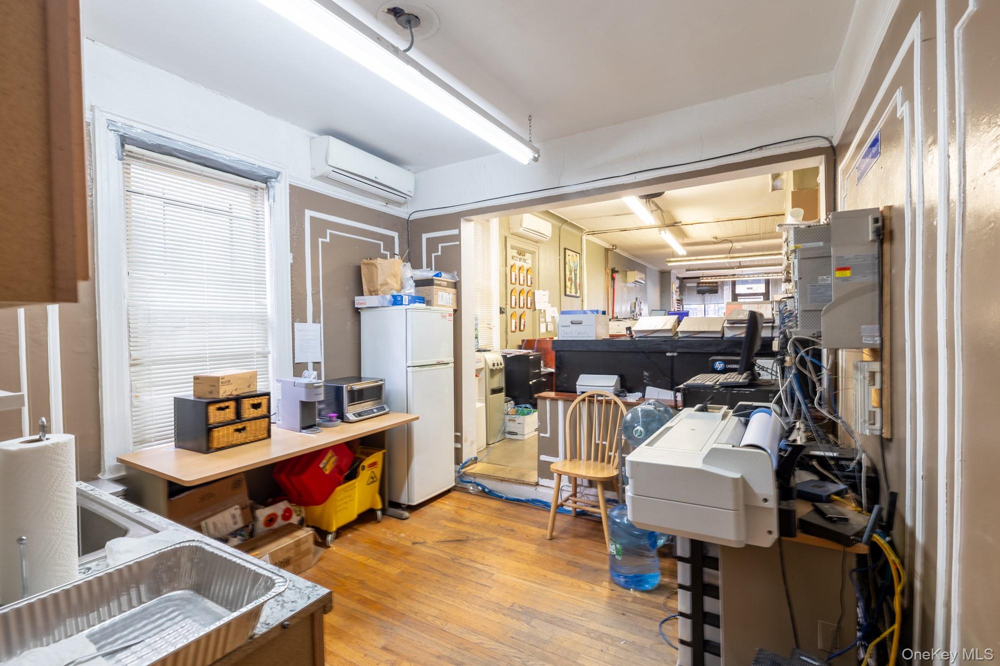 677 Van Nest Avenue Bronx, NY 10462 - Photo 10 of 49 a living room with furniture and a large window