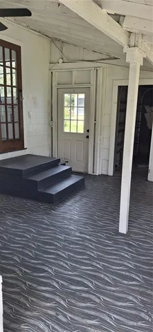 a view of entryway with wooden floor