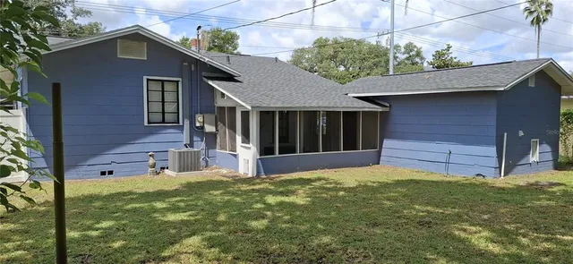 a view of a house with a yard