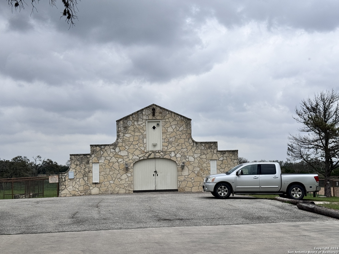 247 Highgate Drive Bandera, TX 78003 - Photo 17 of 21 a view of parking area with truck parked