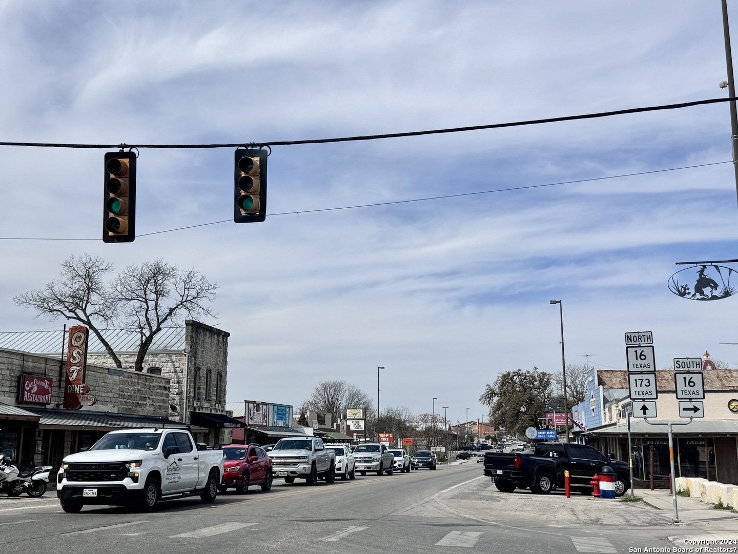 247 Highgate Drive Bandera, TX 78003 - Photo 19 of 21 a view of a cars park in front of a building