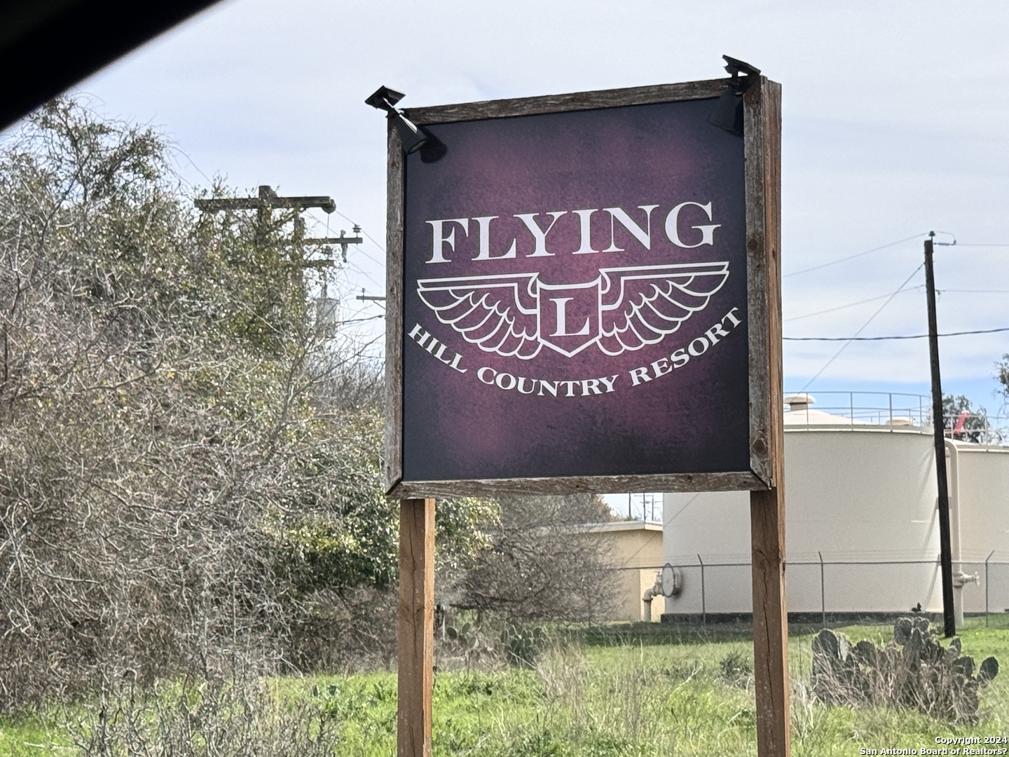 247 Highgate Drive Bandera, TX 78003 - Photo 20 of 21 a sign on the side of a building