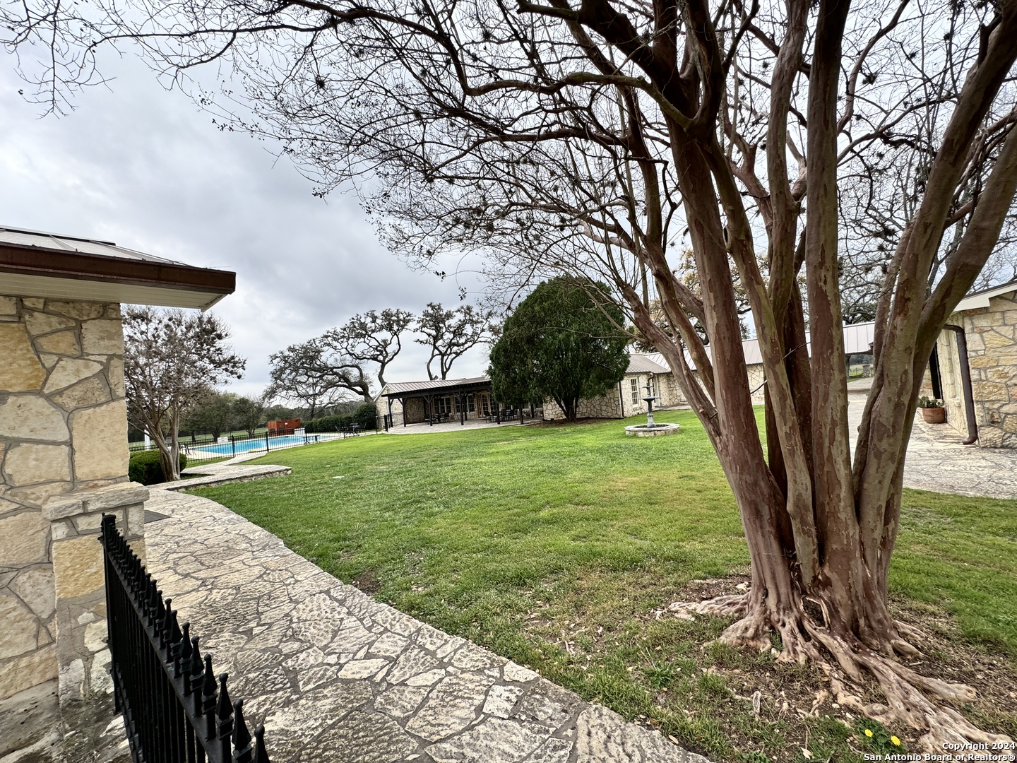247 Highgate Drive Bandera, TX 78003 - Photo 6 of 21 a view of a garden with a tree