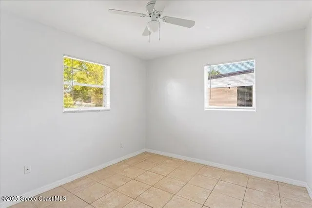 an empty room with windows