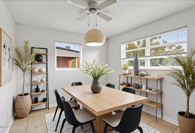 a dining room with furniture and window