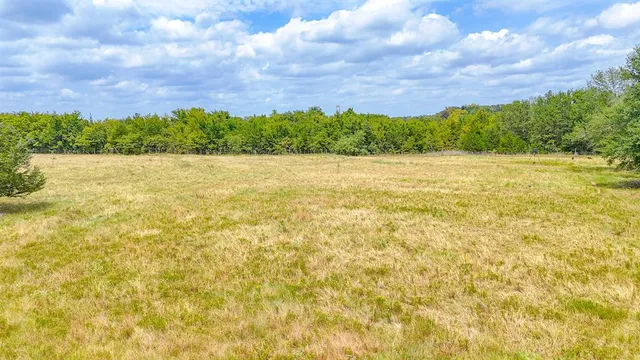 a view of outdoor space with deck and yard