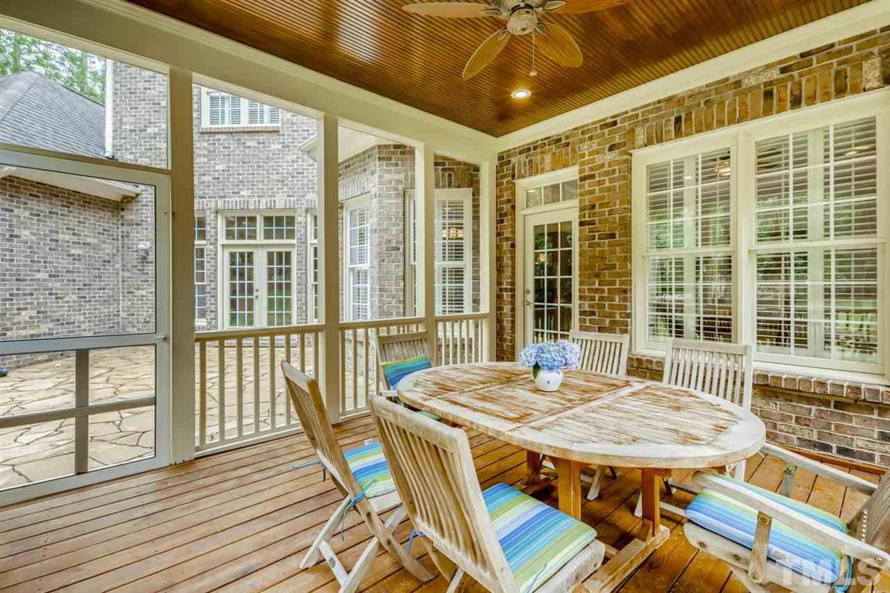 1408 Caistor Lane Raleigh, NC 27614 - Photo 11 of 18 New patio! Access from family room, breakfast room and screened porch! Seeded & straw around area as well.