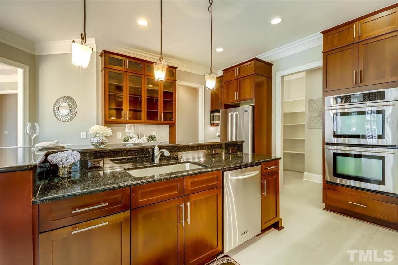 1408 Caistor Lane Raleigh, NC 27614 - Photo 2 of 18 Walk in PANTRY, MUD ROOM are other great features of the kitchen. Gorgeous cabinets and tons of counter space.