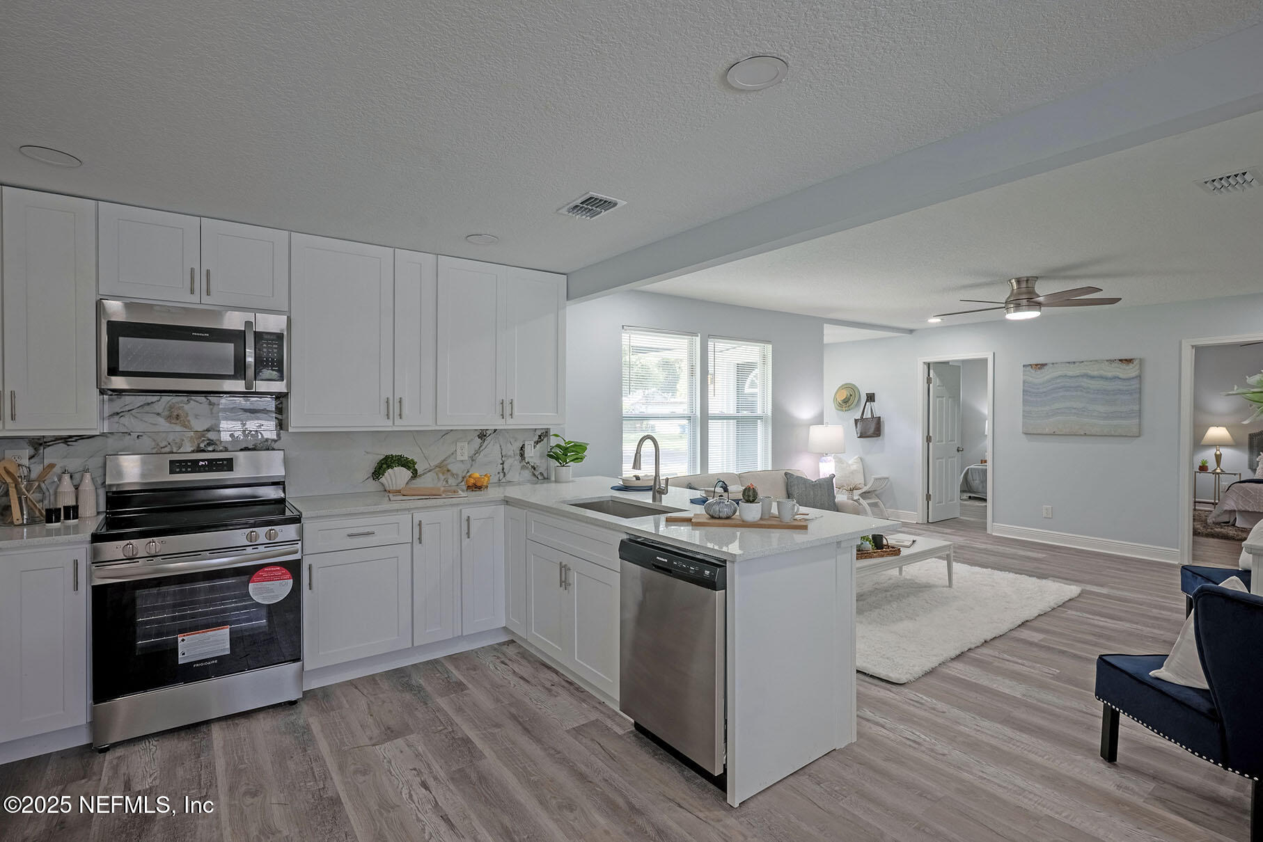 5401 Burdette Road Jacksonville, FL 32211 - Photo 15 of 53 a kitchen with a sink cabinets and wooden floor