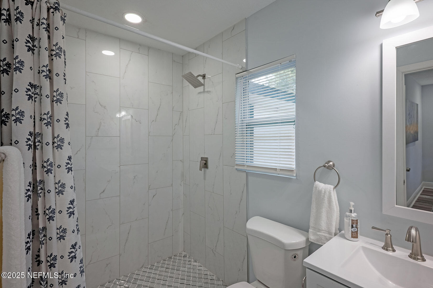 5401 Burdette Road Jacksonville, FL 32211 - Photo 25 of 53 a bathroom with a sink toilet and shower