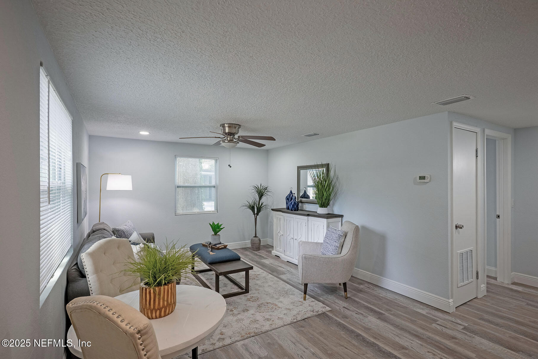 5401 Burdette Road Jacksonville, FL 32211 - Photo 34 of 53 a living room with furniture and a potted plant