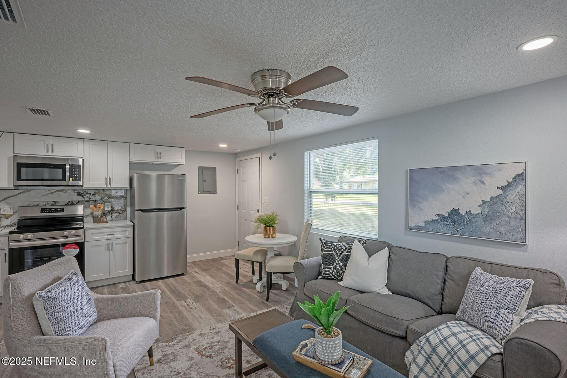 5401 Burdette Road Jacksonville, FL 32211 - Photo 35 of 53 a living room with furniture couches and kitchen view