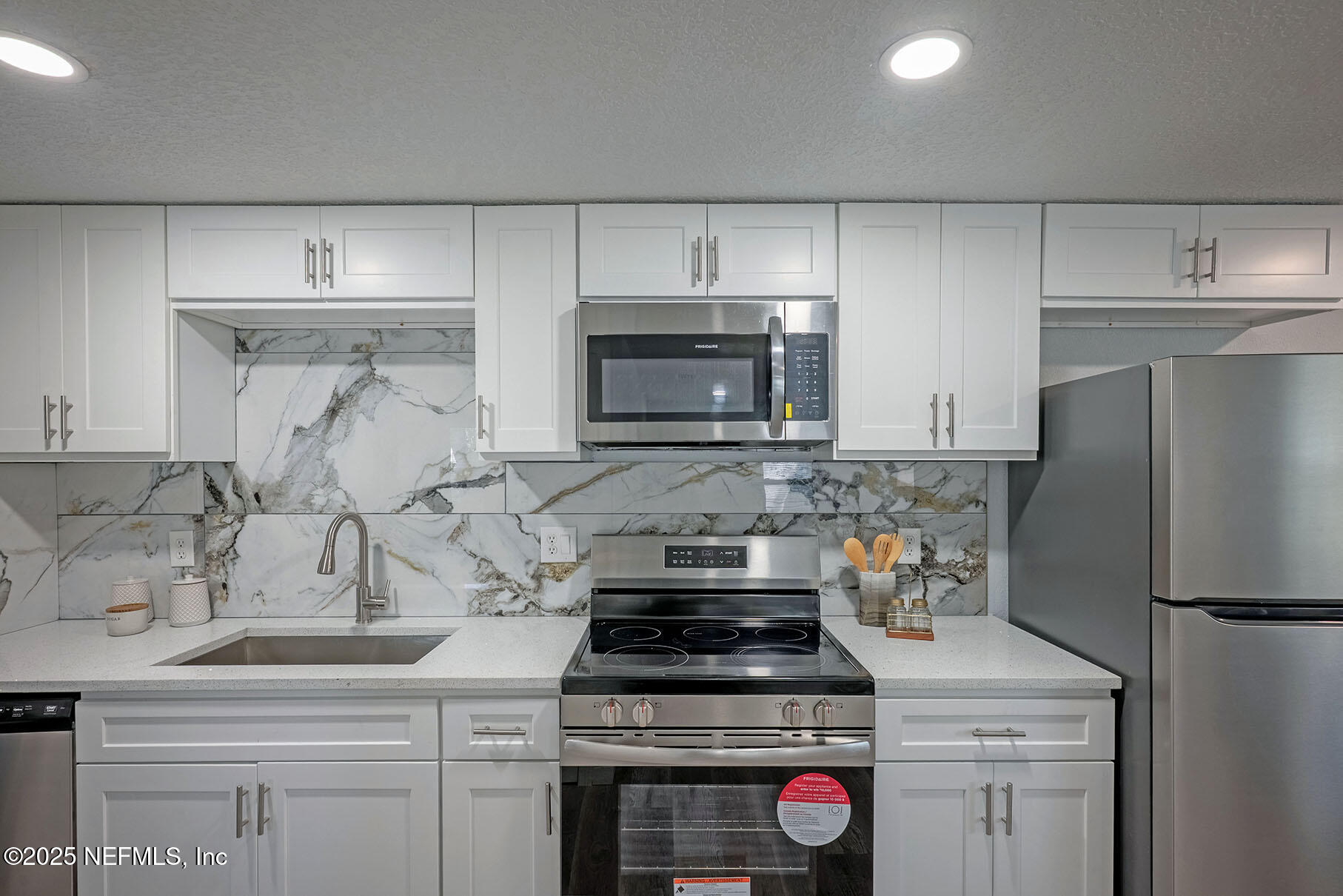 5401 Burdette Road Jacksonville, FL 32211 - Photo 40 of 53 a kitchen with a stove and a refrigerator
