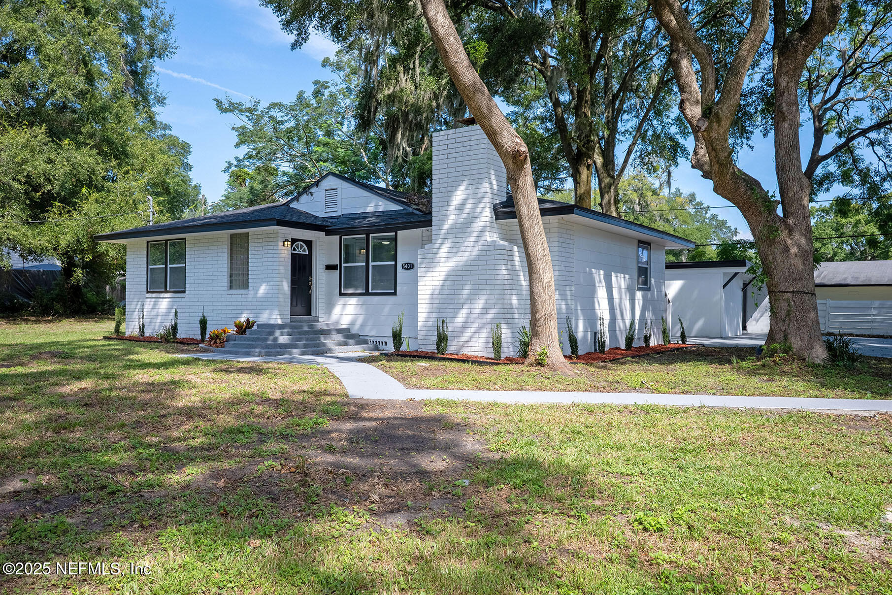 5401 Burdette Road Jacksonville, FL 32211 - Photo 47 of 53 a backyard of a house with barbeque oven table and chairs