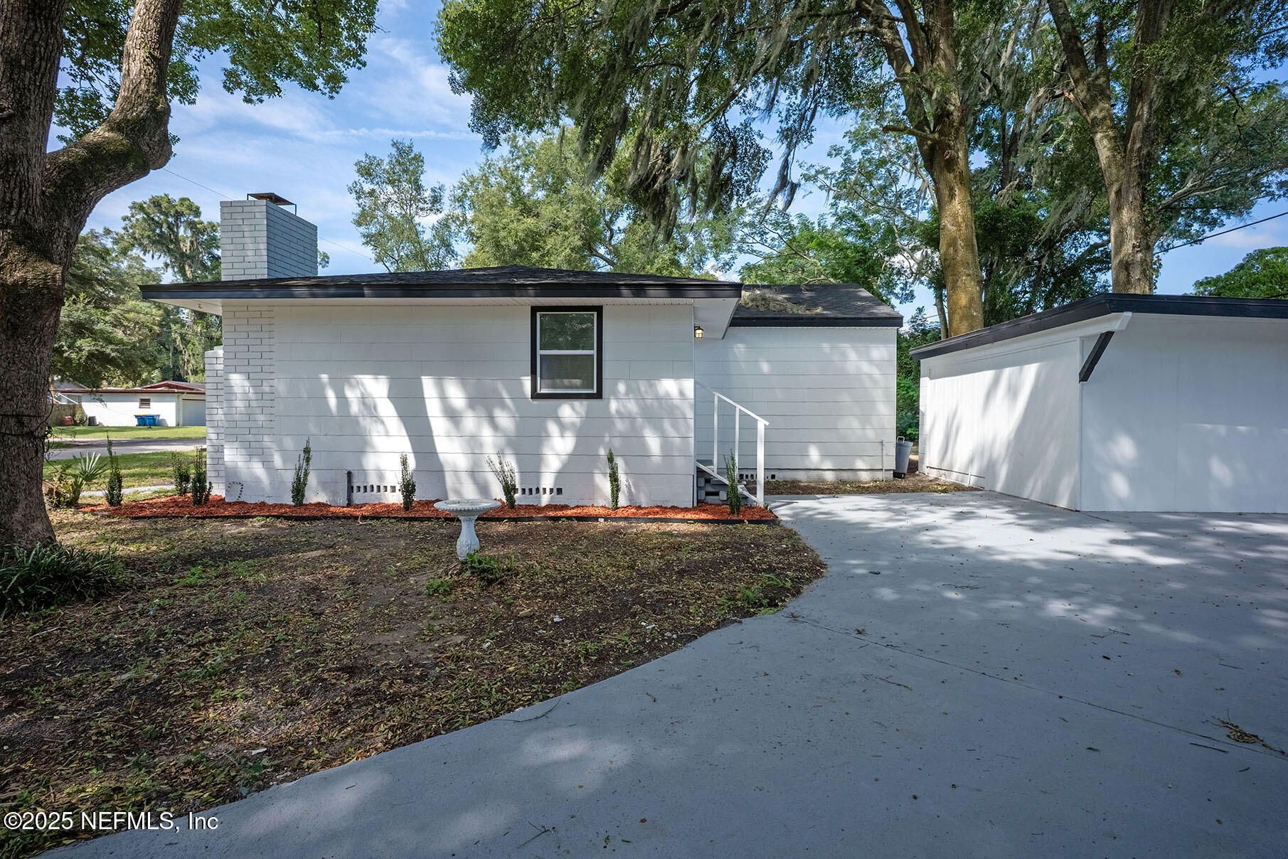 5401 Burdette Road Jacksonville, FL 32211 - Photo 48 of 53 a view of a backyard with large trees