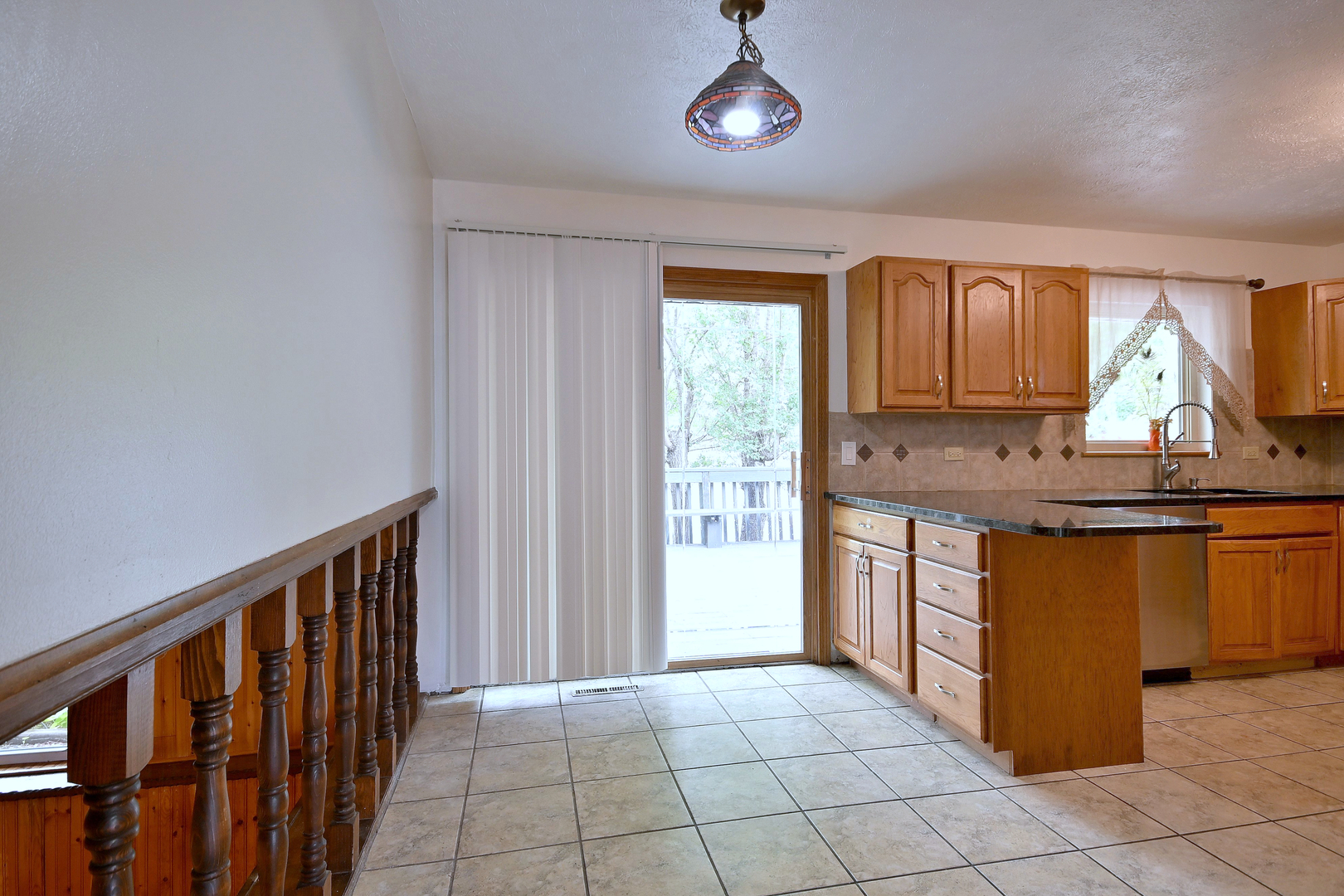 20564 Elizabeth Avenue Prairie View, IL 60089 - Photo 14 of 40 a kitchen with stainless steel appliances granite countertop a stove a sink and a refrigerator with wooden cabinets