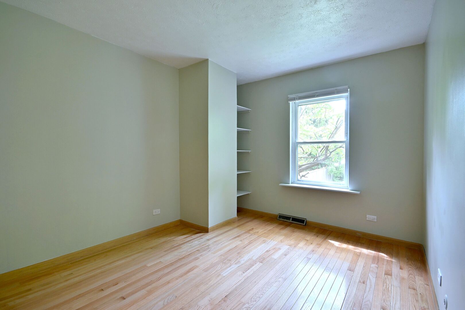 20564 Elizabeth Avenue Prairie View, IL 60089 - Photo 26 of 40 an empty room with wooden floor and windows