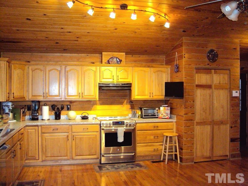 4009 Pixley Pritchard Road Timberlake, NC 27583 - Photo 4 of 25 Extra large kitchen with beautiful wood flooring