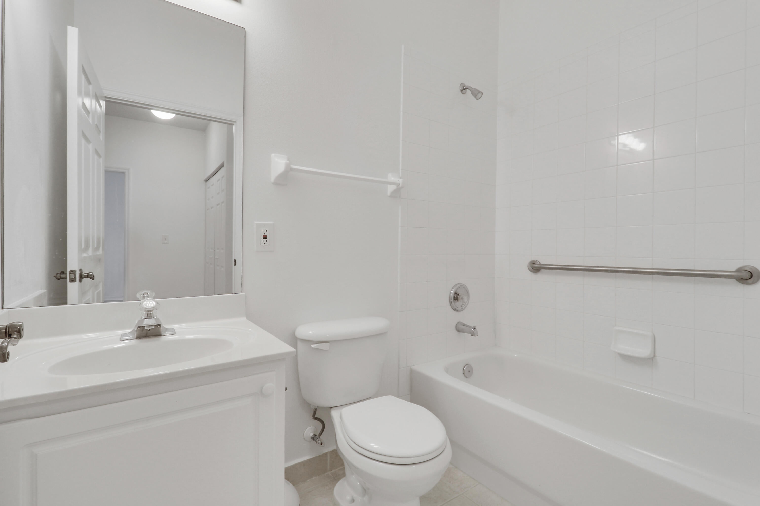 110 Lighthouse Circle, Unit A Tequesta, FL 33469 - Photo 24 of 41 a bathroom with a toilet a sink and a bathtub