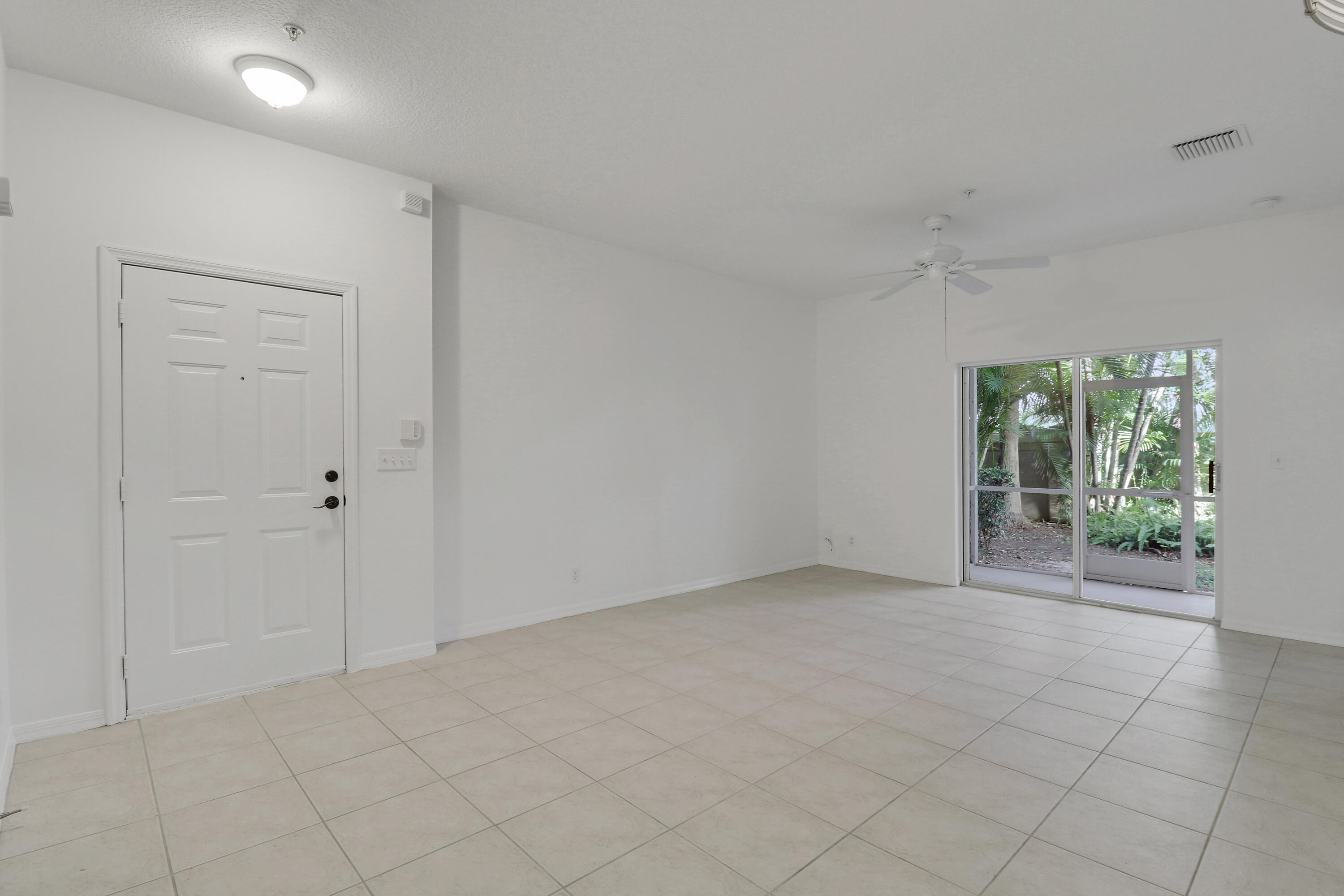 110 Lighthouse Circle, Unit A Tequesta, FL 33469 - Photo 3 of 41 a view of an empty room with a window