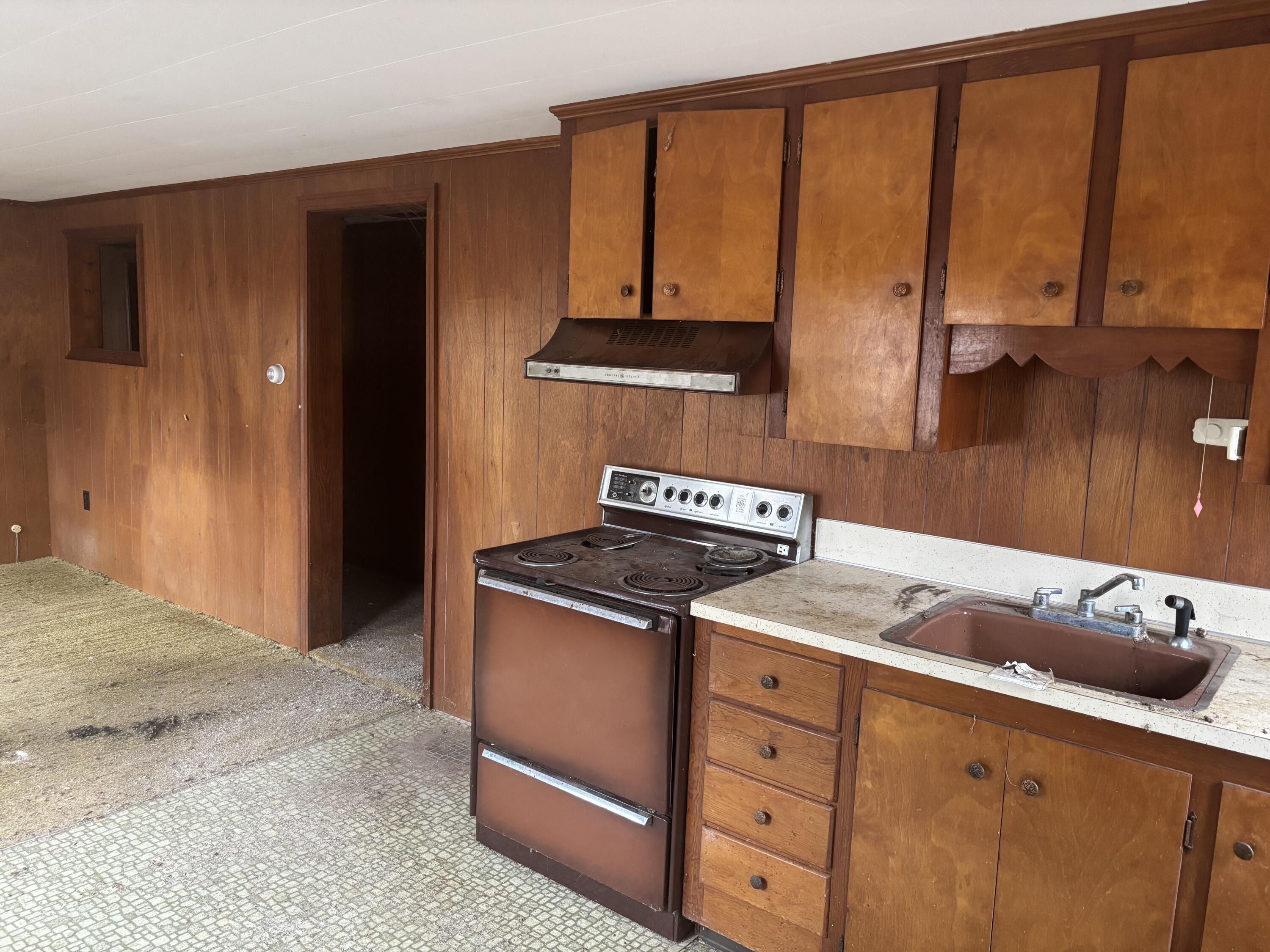 202 Route 28 West Harwich, MA 02671 - Photo 18 of 19 a kitchen with stainless steel appliances granite countertop a stove a sink and a microwave