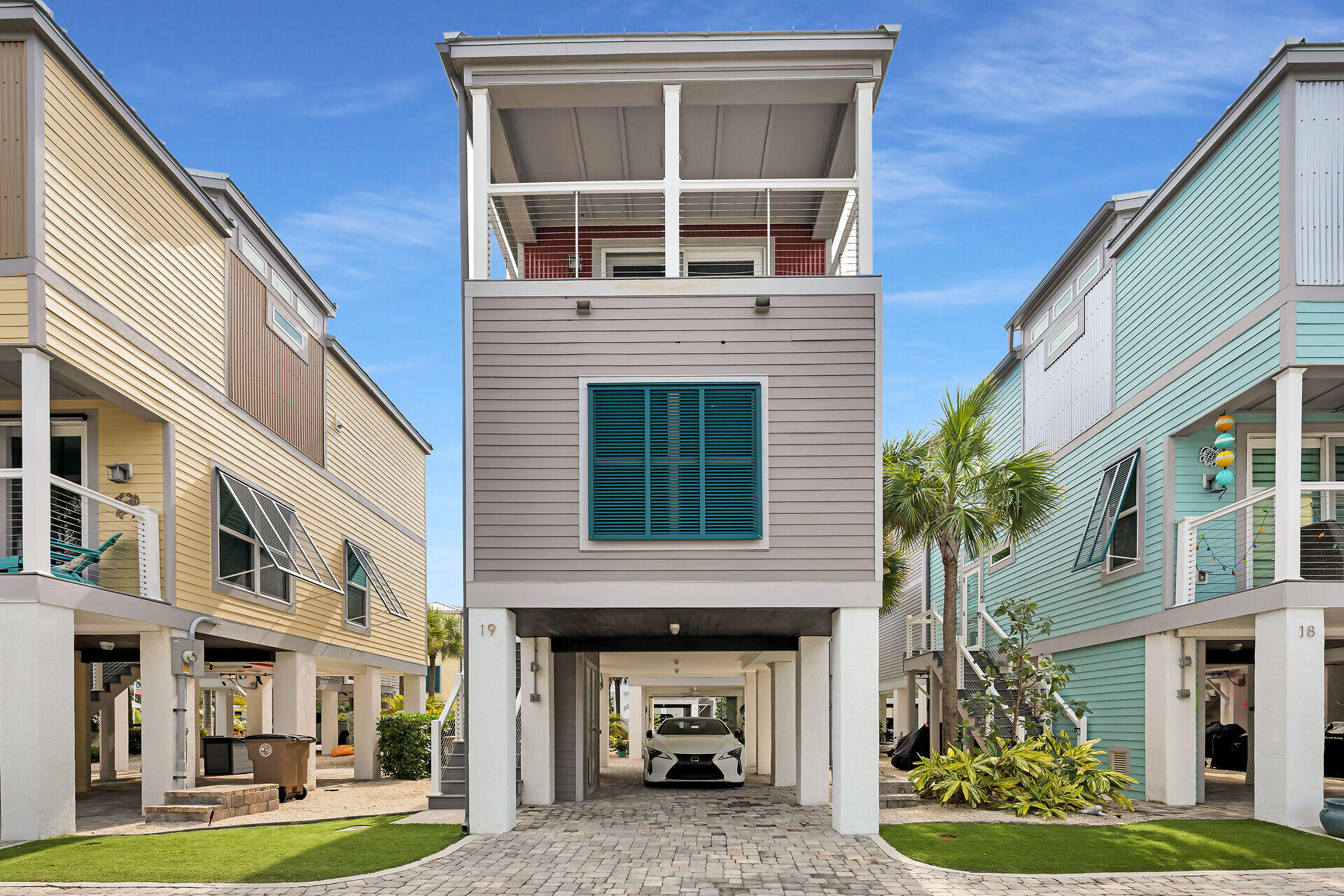 101 11th Street, Unit 19 Marathon, FL 33050 - Photo 2 of 27 a front view of a building with garden