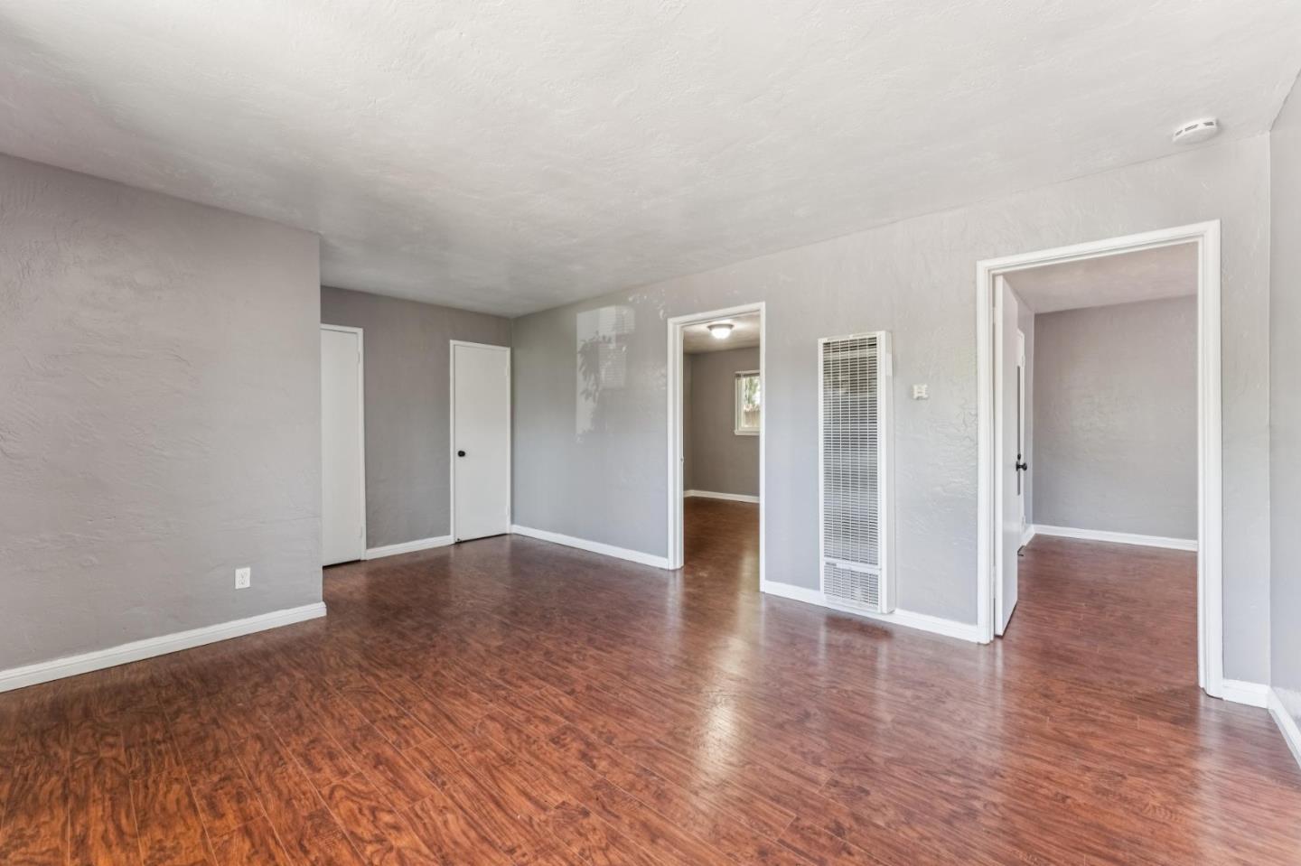 5664 Gaskill Street Oakland, CA 94608 - Photo 5 of 16 a view of empty room with wooden floor
