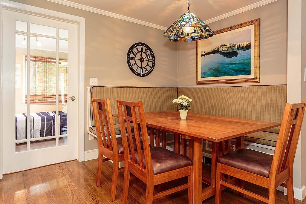 17 Dennett Road Winchester, MA 01890 - Photo 12 of 41 a dining room with a wooden table and chairs