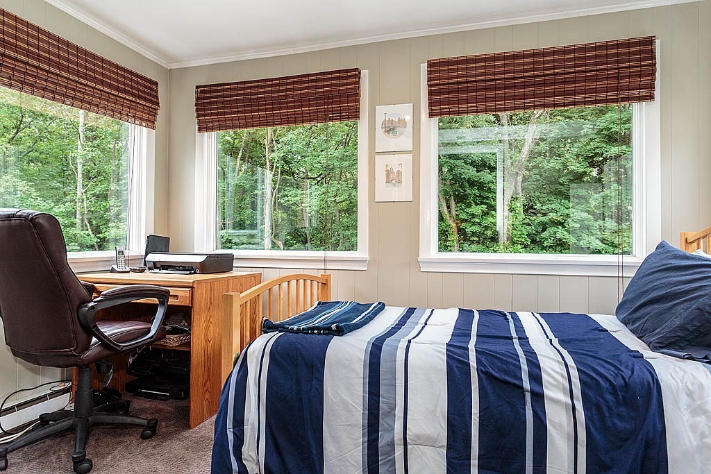 17 Dennett Road Winchester, MA 01890 - Photo 13 of 41 a bedroom with a bed and a desk