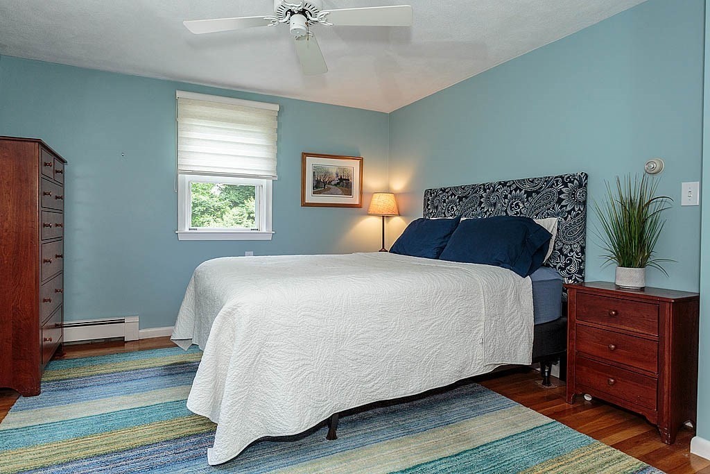 17 Dennett Road Winchester, MA 01890 - Photo 15 of 41 a bedroom with a bed and a window