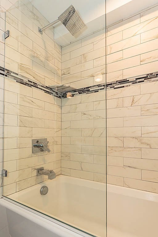 17 Dennett Road Winchester, MA 01890 - Photo 21 of 41 a bathroom with a shower and a bathtub