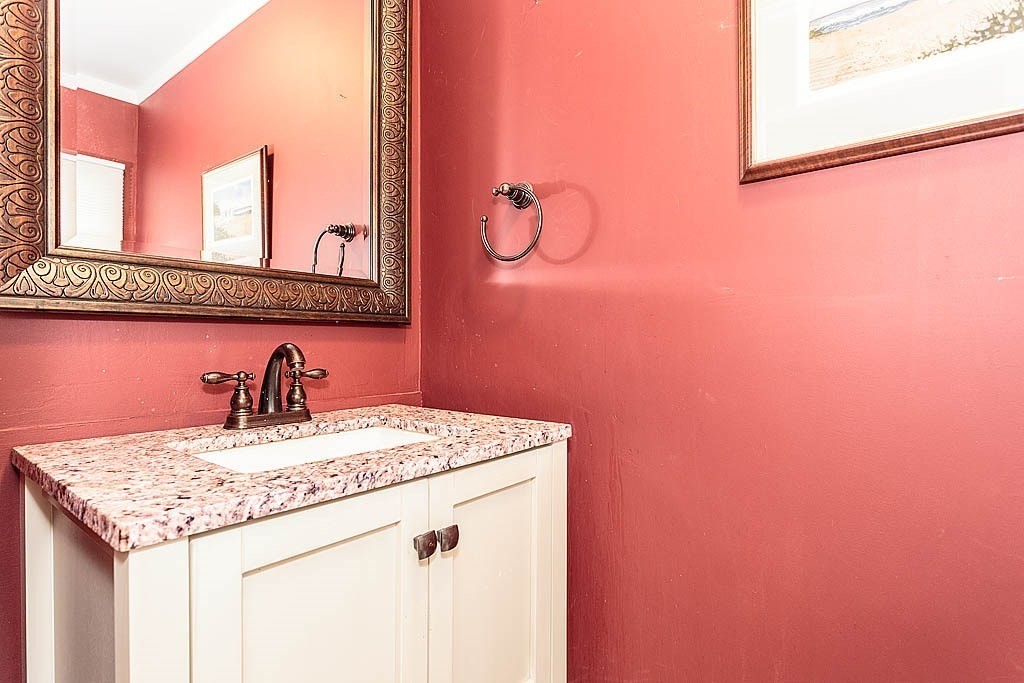 17 Dennett Road Winchester, MA 01890 - Photo 24 of 41 a bathroom with a sink and a mirror