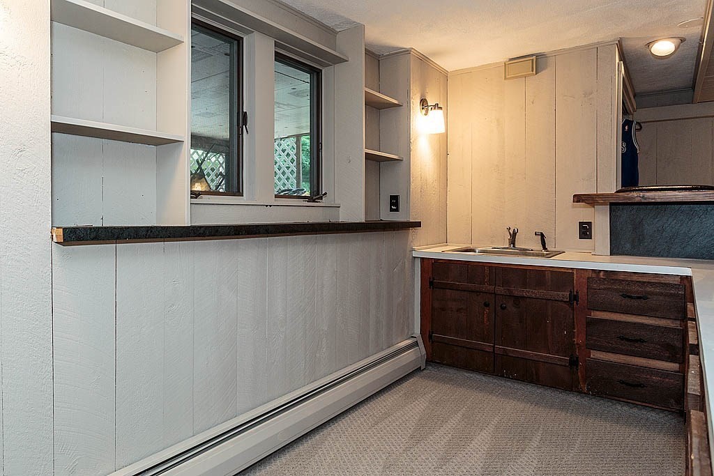 17 Dennett Road Winchester, MA 01890 - Photo 27 of 41 a bathroom with a sink and a mirror