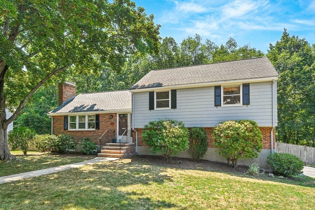 17 Dennett Road Winchester, MA 01890 - Photo 3 of 41 front view of a house with a yard