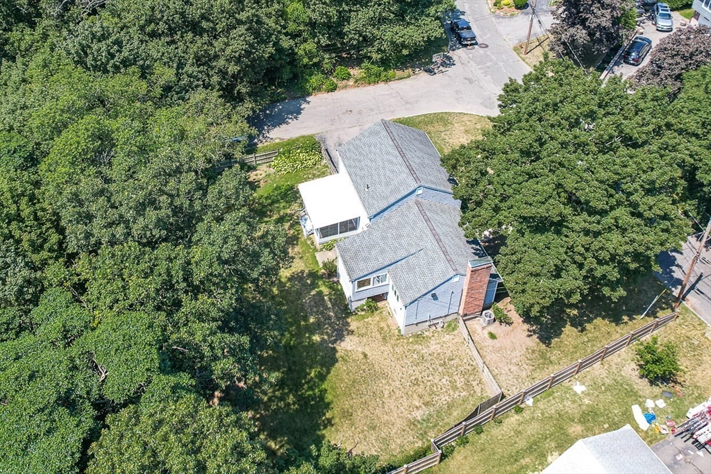 17 Dennett Road Winchester, MA 01890 - Photo 39 of 41 an aerial view of a house with a yard and trees all around
