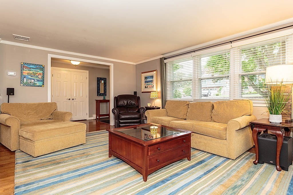 17 Dennett Road Winchester, MA 01890 - Photo 8 of 41 a living room with furniture and a large window