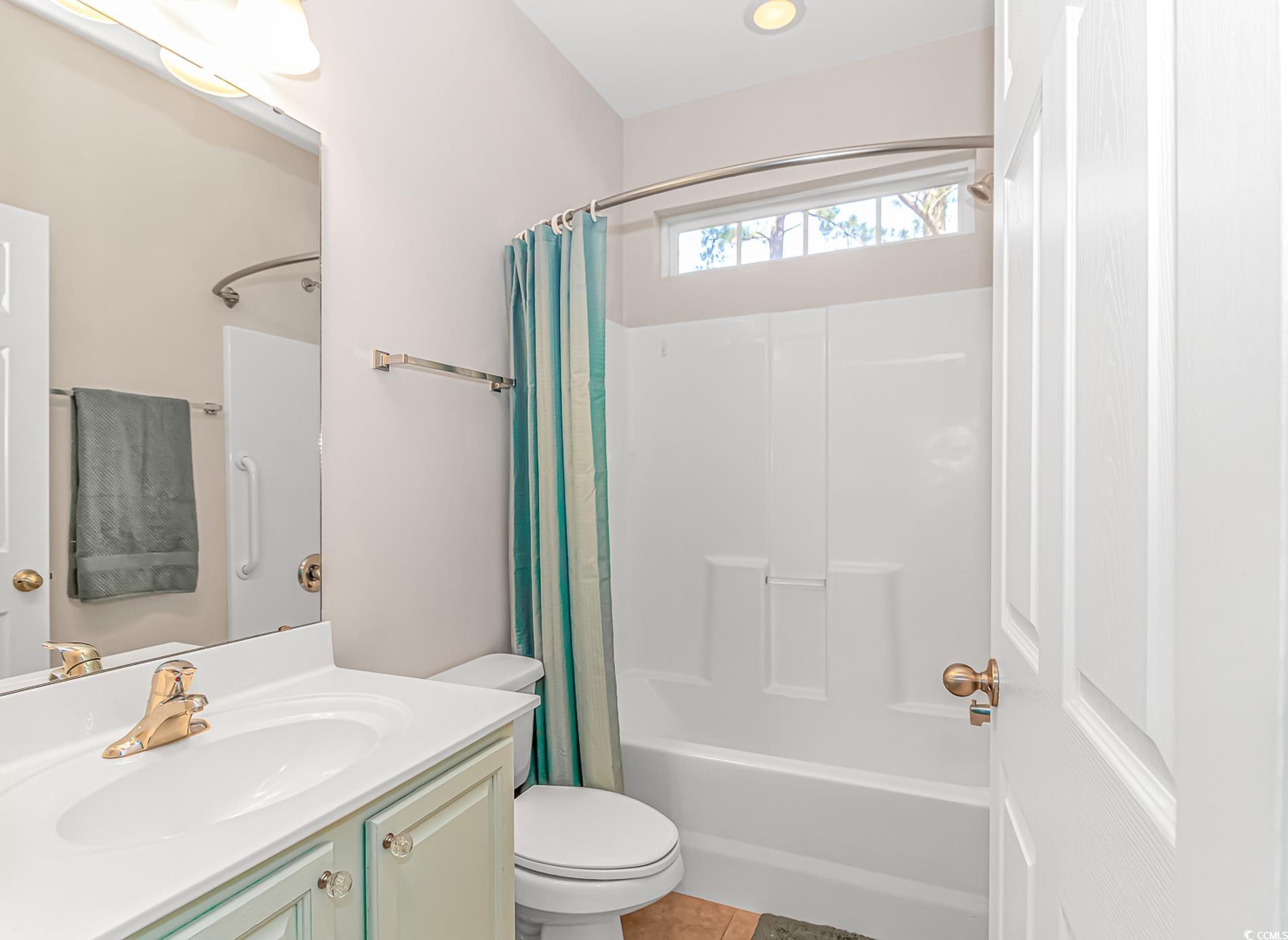 139 Chenoa Drive, Unit D Murrells Inlet, SC 29576 - Photo 19 of 34 Bathroom with shower / bath combo, vanity, and light tile patterned flooring