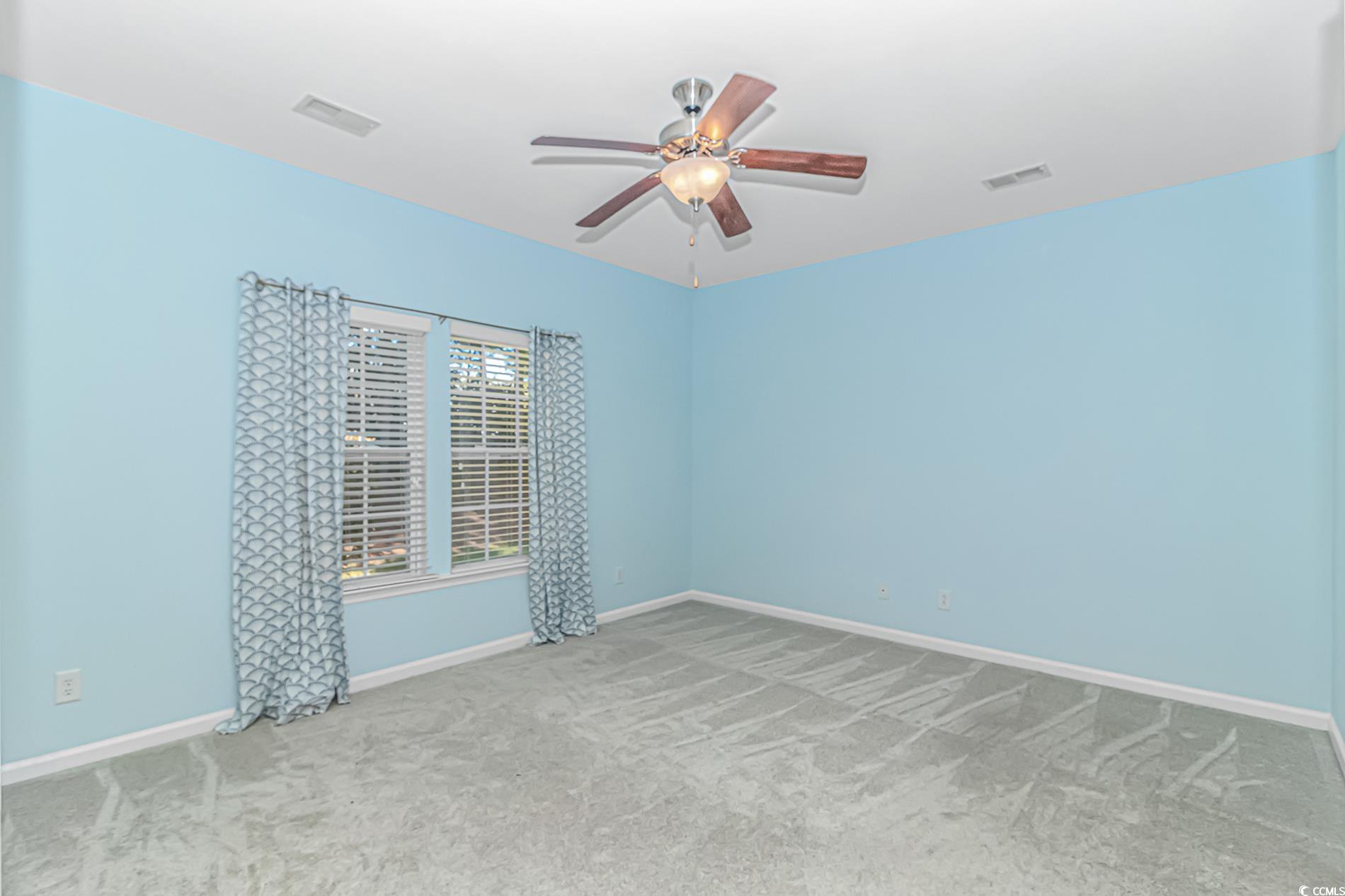 139 Chenoa Drive, Unit D Murrells Inlet, SC 29576 - Photo 23 of 34 Unfurnished room featuring carpet floors and a ceiling fan