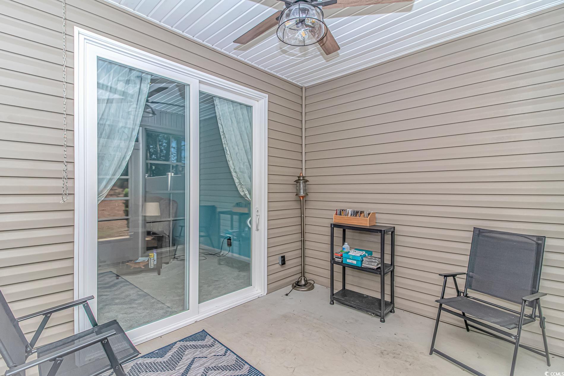 139 Chenoa Drive, Unit D Murrells Inlet, SC 29576 - Photo 25 of 34 Sunroom / solarium with a ceiling fan
