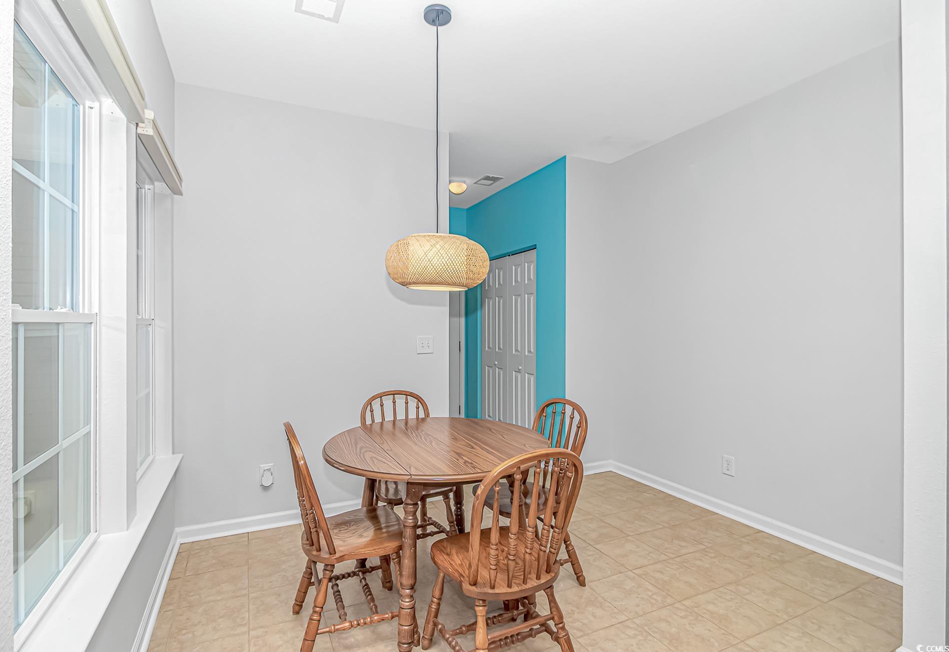 139 Chenoa Drive, Unit D Murrells Inlet, SC 29576 - Photo 9 of 34 Dining area featuring baseboards and light tile patterned floors