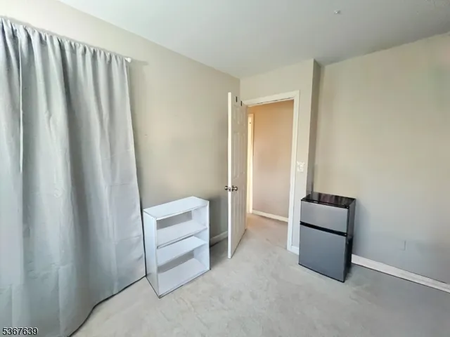 a view of room with window and closet