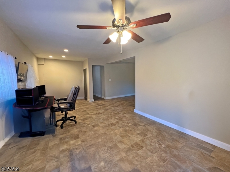 29 Billings Road Hopatcong, NJ 07843 - Photo 4 of 14 a view of a workspace with furniture and a window