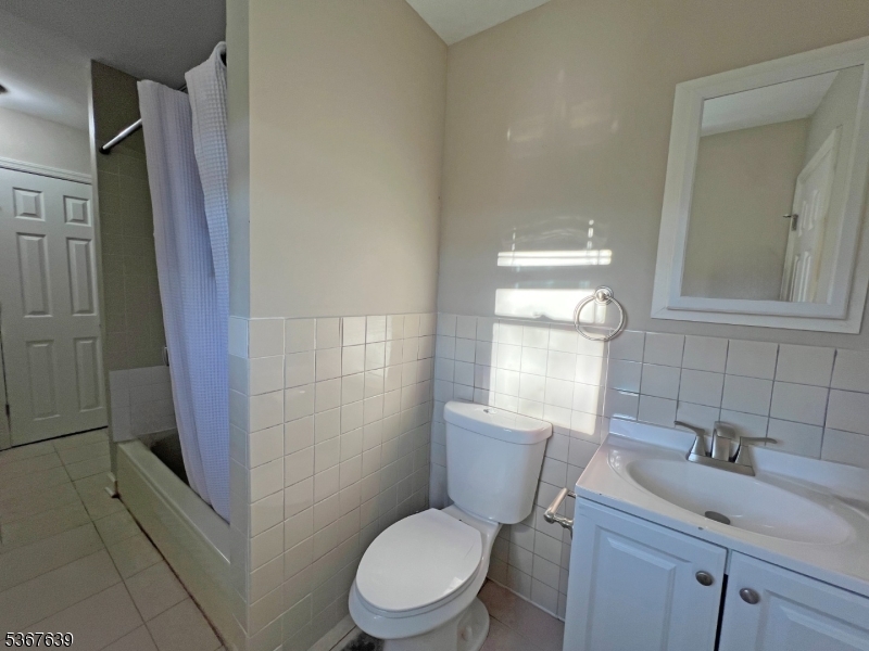 29 Billings Road Hopatcong, NJ 07843 - Photo 5 of 14 a bathroom with a toilet sink a shower and vanity