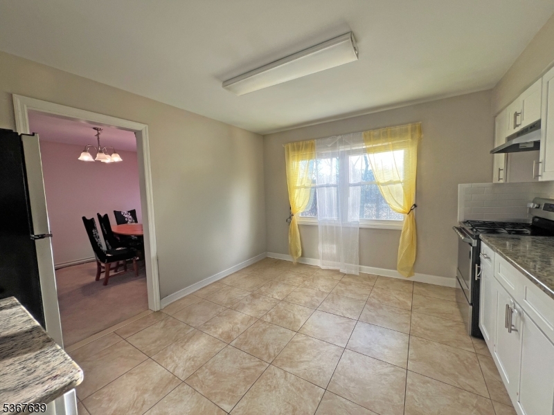 29 Billings Road Hopatcong, NJ 07843 - Photo 10 of 14 a view of a kitchen with fridge and workspace