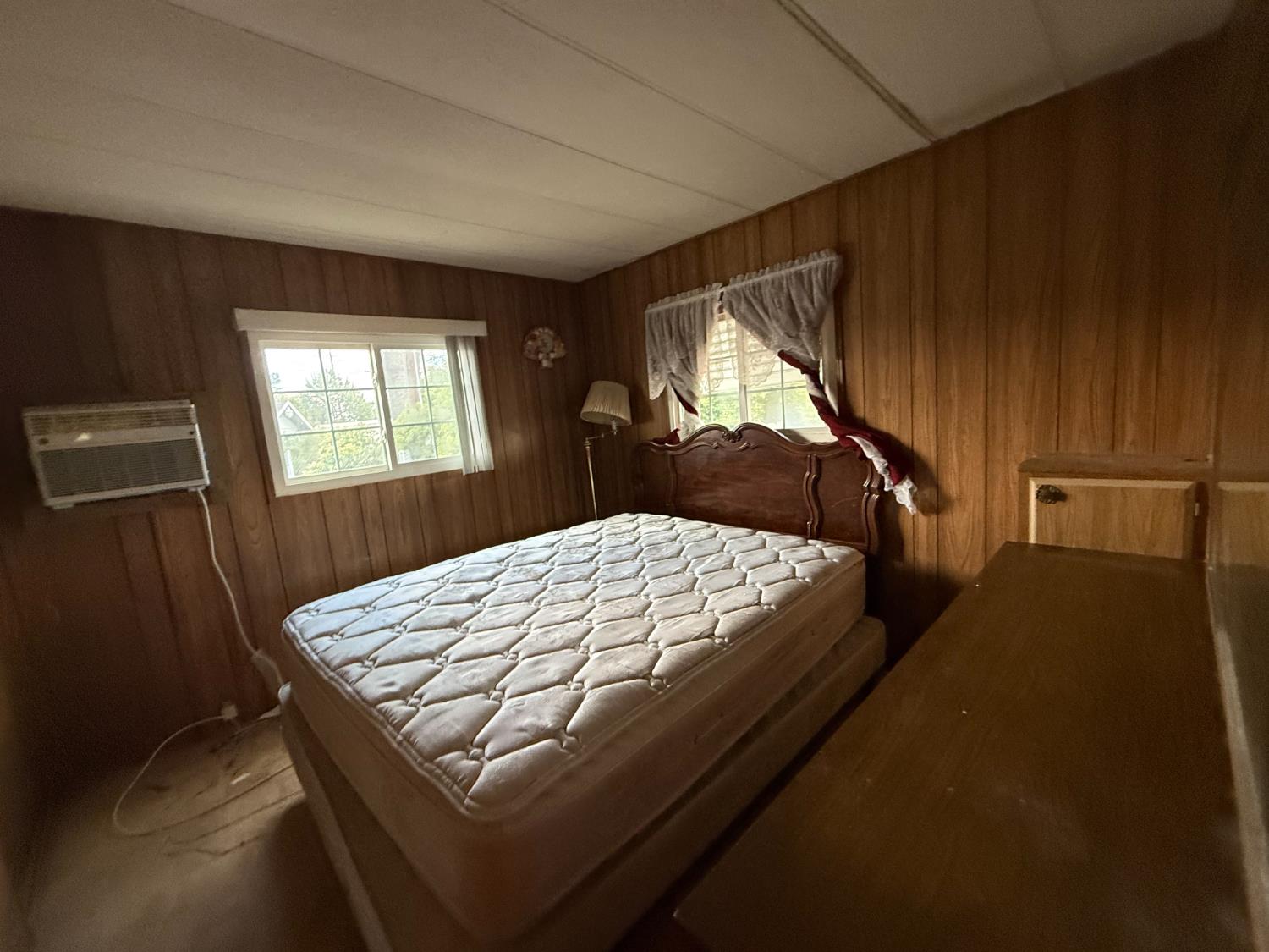 5835 Cherokee Road, Unit 41 Stockton, CA 95215 - Photo 20 of 35 a bed sitting in a bedroom next to a window
