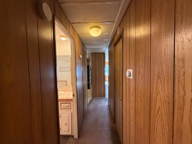 a view of hallway with livingroom