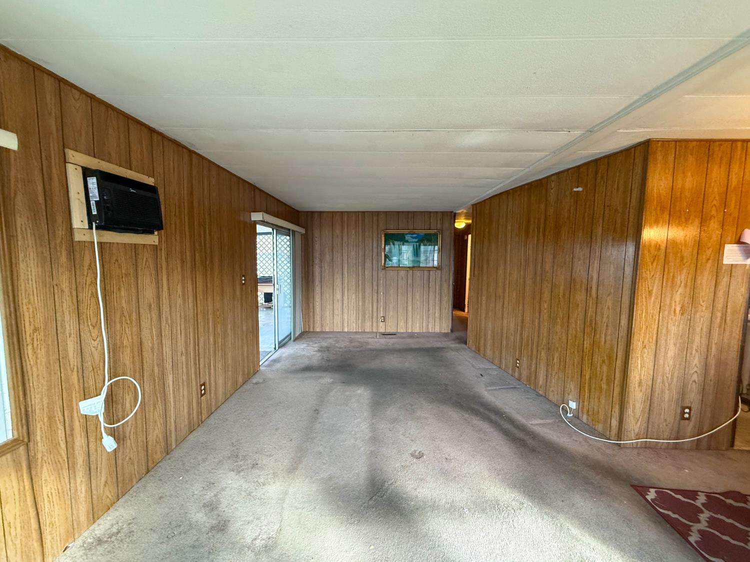 5835 Cherokee Road, Unit 41 Stockton, CA 95215 - Photo 27 of 35 a view of a livingroom with wooden floor and door