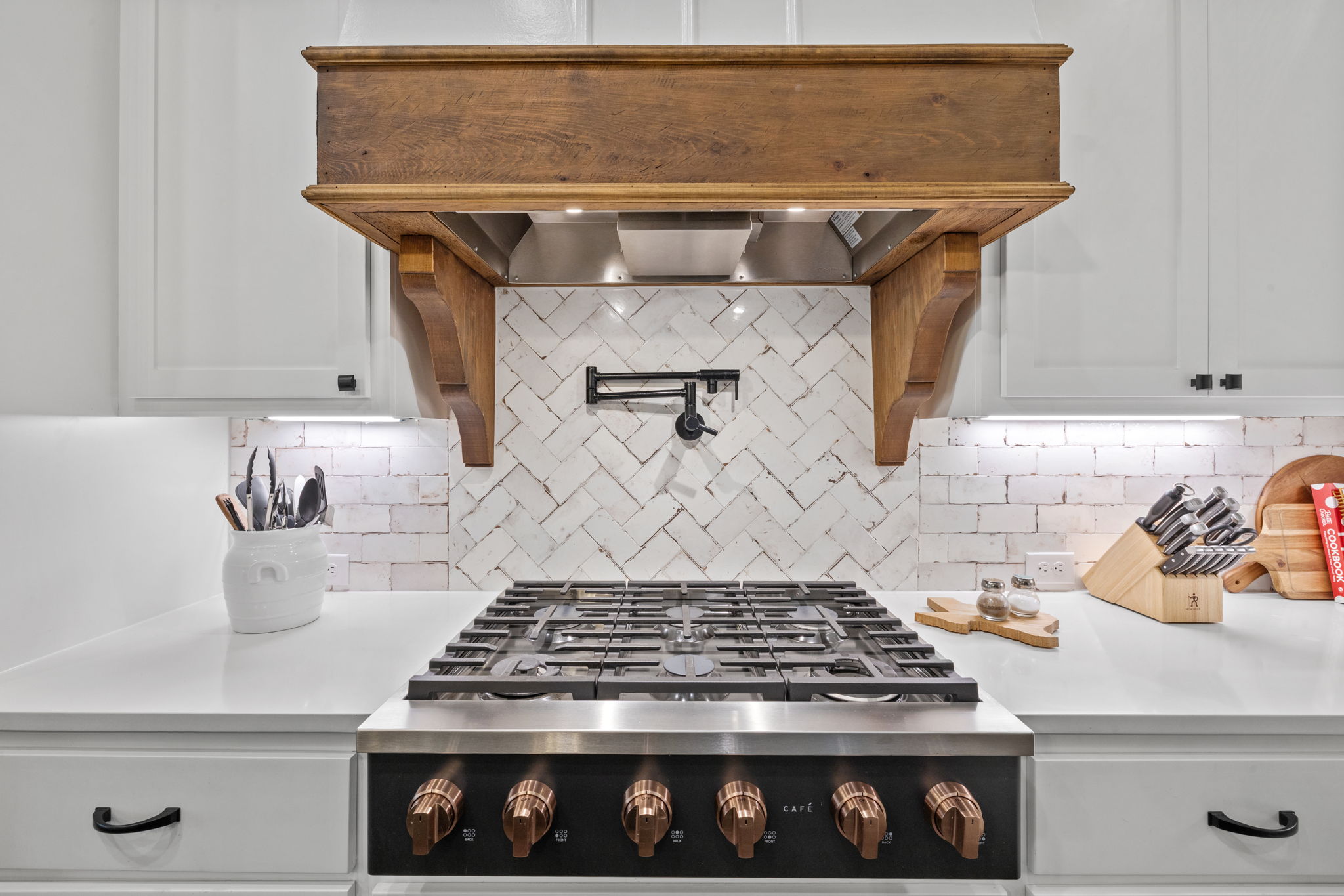 104 Lower Cedar Cove Georgetown, TX 78633 - Photo 13 of 37 a stove top oven sitting inside of a kitchen