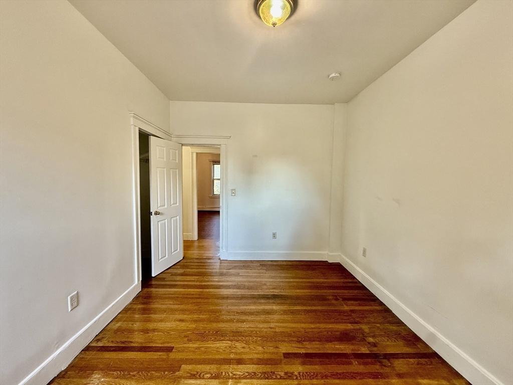 62 Algonquin Road, Unit 2 Newton, MA 02467 - Photo 24 of 38 a view of a room with wooden floor
