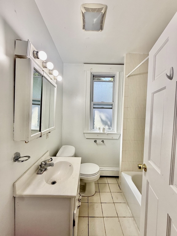 62 Algonquin Road, Unit 2 Newton, MA 02467 - Photo 32 of 38 a bathroom with a sink a toilet and shower
